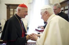 Pope Benedict XVI shakes hands with Italian cardinal Bagnasco during a meeting at the Vatican