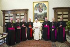 Pope Benedict XVI poses with Italian cardinal Bagnasco and bishops from the Liguria region during a meeting at the Vatican